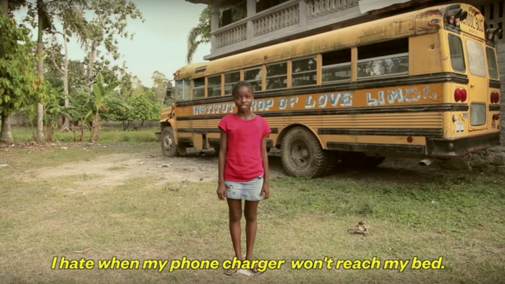 A still from the WaterIsLife viral video starring people in Kenya reading first world problems.
