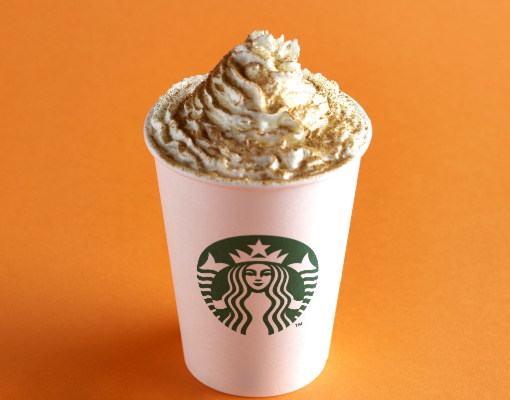 A Starbucks Pumpkin Spice Latte is shown on an orange background.